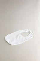 CHILDREN'S BIB WITH TRIM