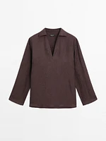 Flowing shirt featuring long sleeves with vents