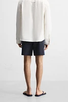 MAILLOT DE BAIN LONG À BANDES CARREAUX