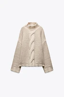 PULL EN MAILLE À TORSADES