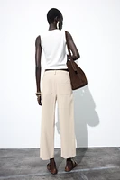 PLEATED CHINO PANTS