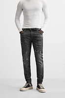 SPLATTERED RIPPED SKINNY JEANS