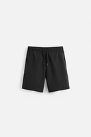 BASIC LONG SWIM TRUNKS