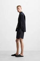 PLEATED BELT BERMUDA SHORTS