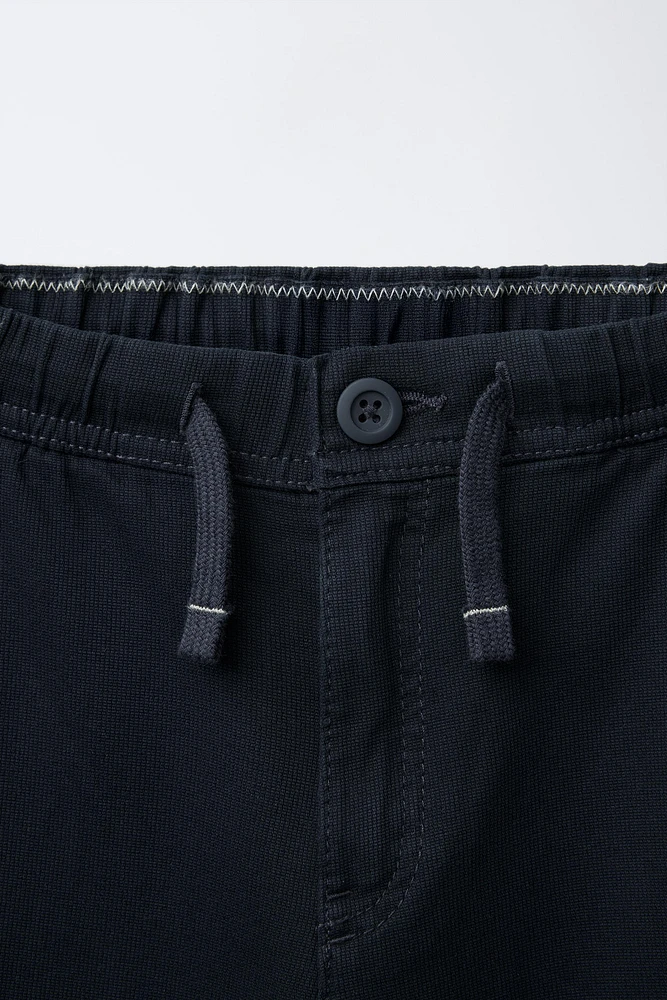 TEXTURED STRETCH PANTS