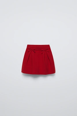KNIT SKIRT WITH BOWS
