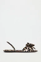 ANIMAL PRINT BOW FLAT SANDALS