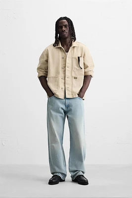 VESTE DÉLAVÉE À ÉCLABOUSSURES