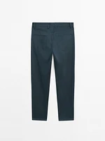 Faux jean tapered fit en coton mélangé
