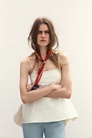 TOP PÉPLUM ASYMÉTRIQUE