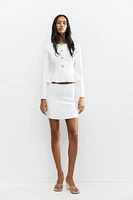 GILET PEPLUM EN MAILLE FINE