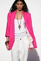 VESTE À MANCHES RETROUSSÉES