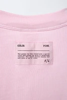 T-SHIRT UNI À ÉTIQUETTE