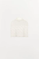 CAPE EN MAILLE TRICOT