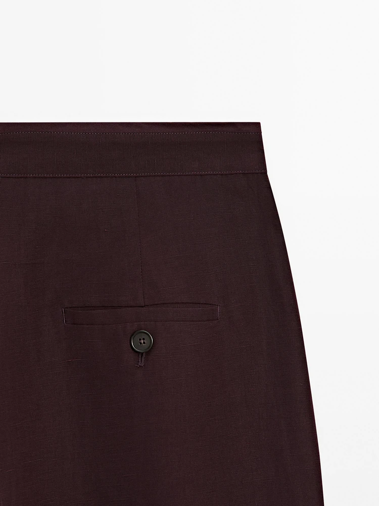 Flowing trousers with darts and thin waistband