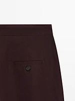 Flowing trousers with darts and thin waistband