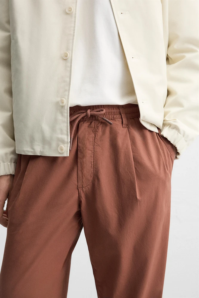 PLEATED POPLIN PANTS