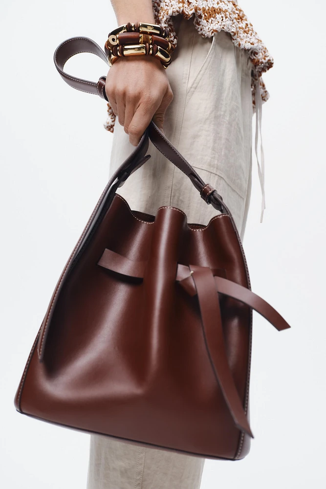KNOTTED TOPSTITCHED BUCKET BAG