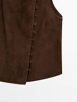 Veste courte sans manches boutons en cuir finition daim