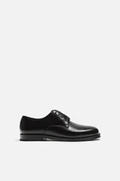 CHAUSSURES EN CUIR HABILLÉES