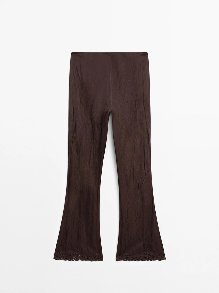 Capri trousers with blonde lace detail