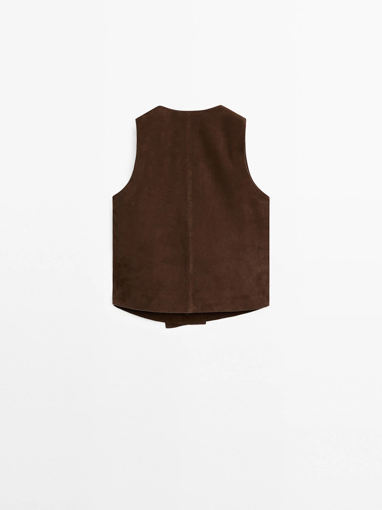 Veste courte sans manches boutons en cuir finition daim