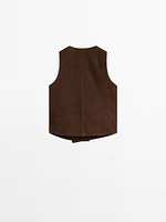 Veste courte sans manches boutons en cuir finition daim