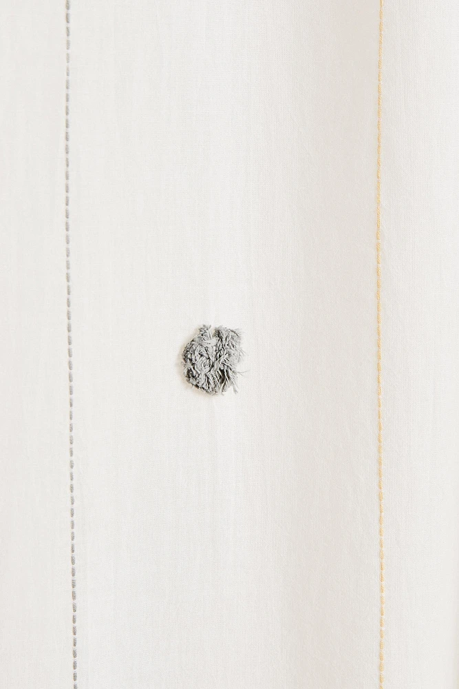 LOW OPACITY TASSEL CURTAIN