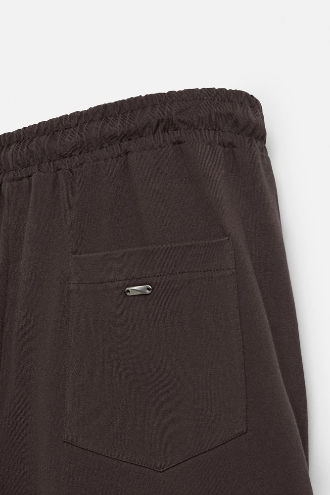 PLEATED OVERSIZED FIT BERMUDA SHORTS