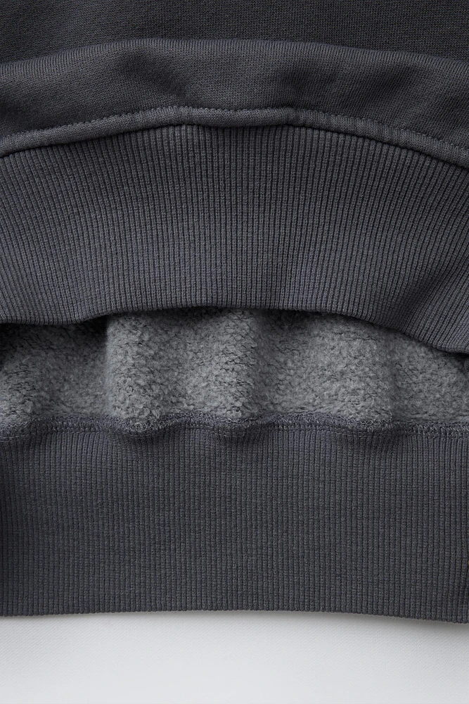 SWEAT À CAPUCHE IMPRIMÉ