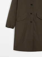 Trench tissu technique boutonnage
