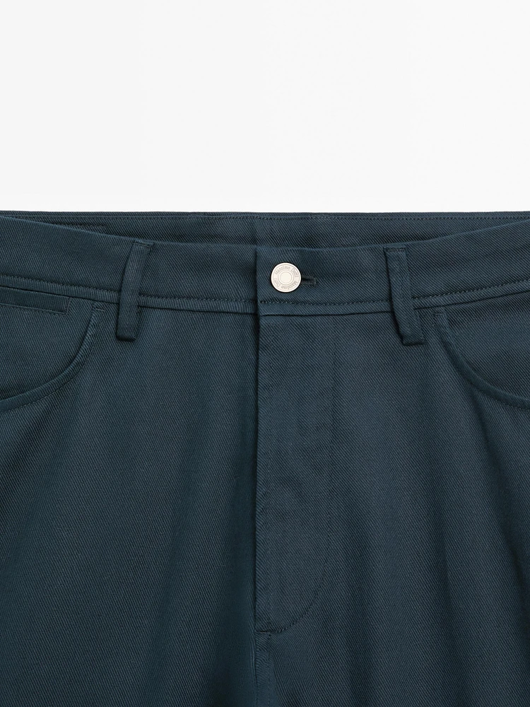 Faux jean tapered fit en coton mélangé