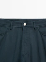 Faux jean tapered fit en coton mélangé