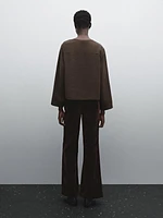 Flowing shirt with button detail on the chest
