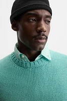 Relaxed fit cotton blend sweater. Round neck and long sleeves. Rib trim.