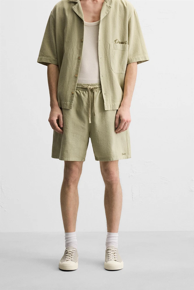 TEXTURED EMBROIDERED SHORTS