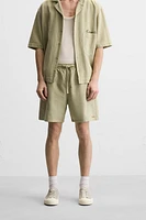 TEXTURED EMBROIDERED SHORTS