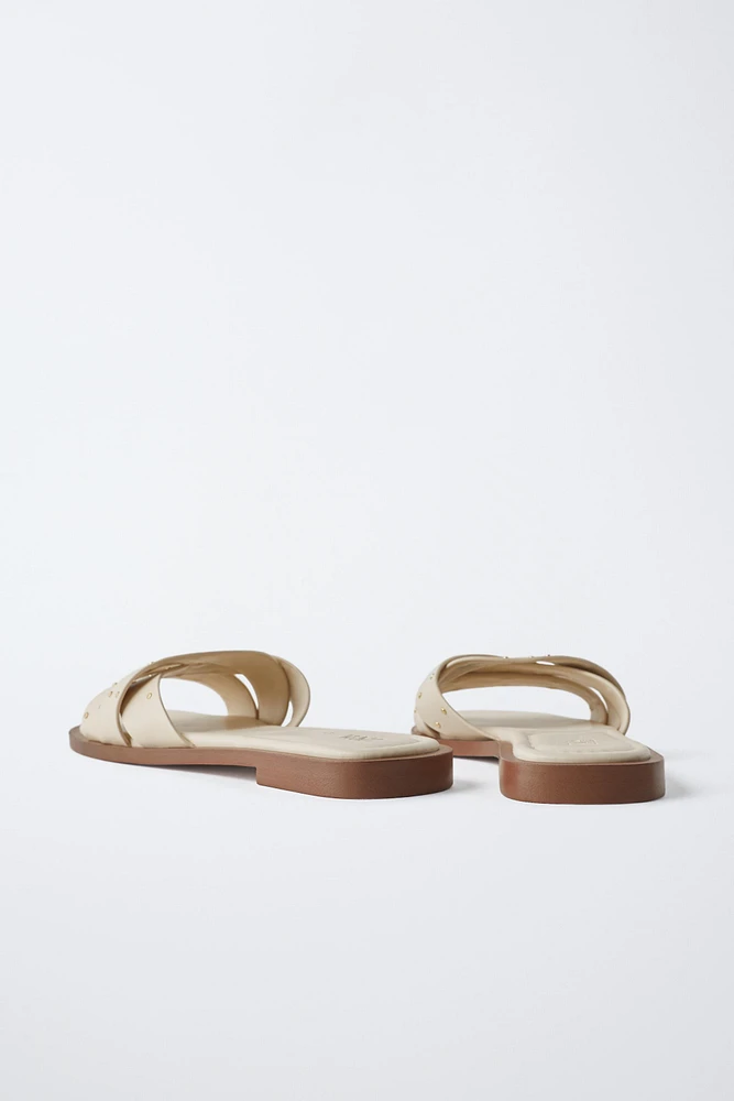 STUDDED CROSSOVER FLAT SANDALS