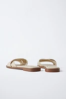 STUDDED CROSSOVER FLAT SANDALS