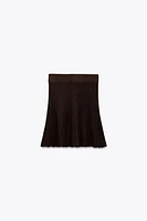 PLEATED SOLID KNIT SKIRT
