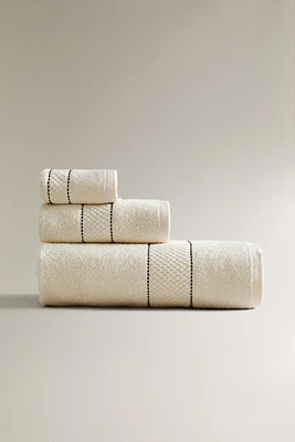 SERVIETTE DE BAIN BORDURE SURPIQÛRES