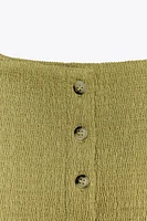 TOP TEXTURÉ À BOUTONS