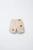 HÔTEL MAGIQUE © X ZARA PATCH SHORTS