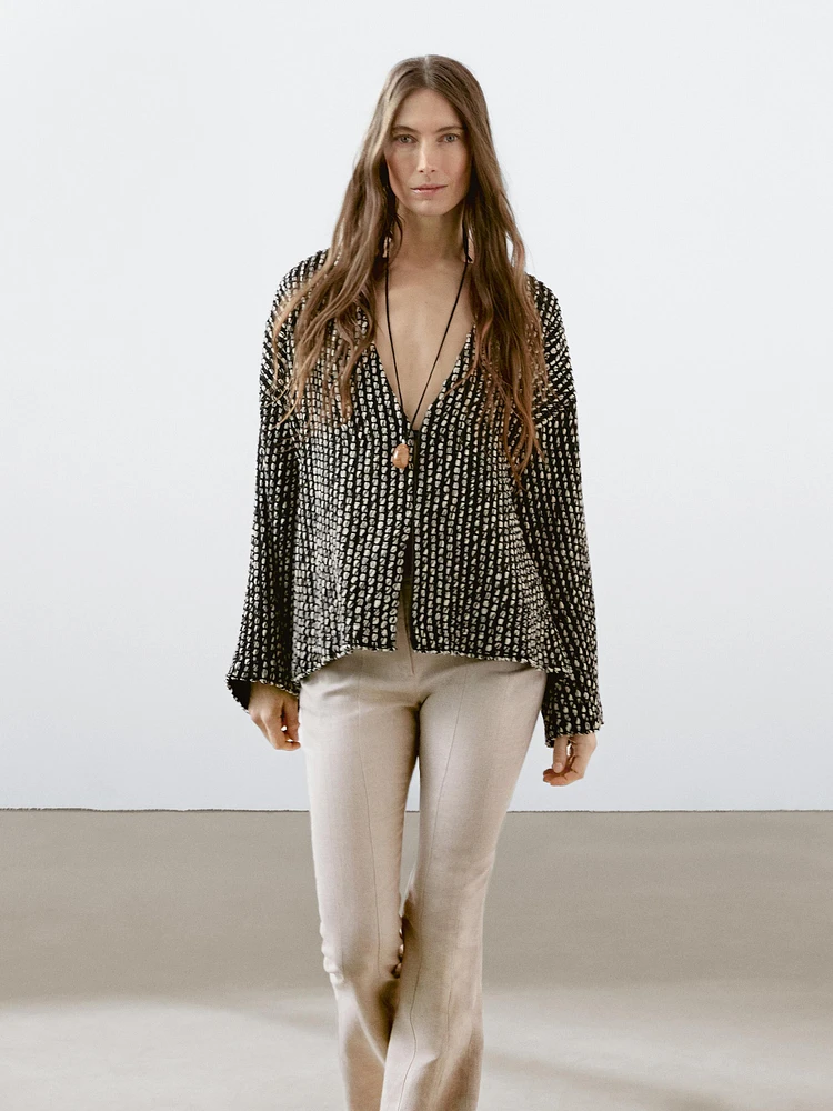 Pantalon flare taille contrastante