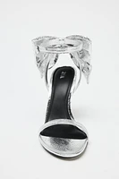 METALLIC EFFECT BOW SANDALS