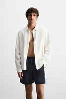 MAILLOT DE BAIN LONG À BANDES CARREAUX