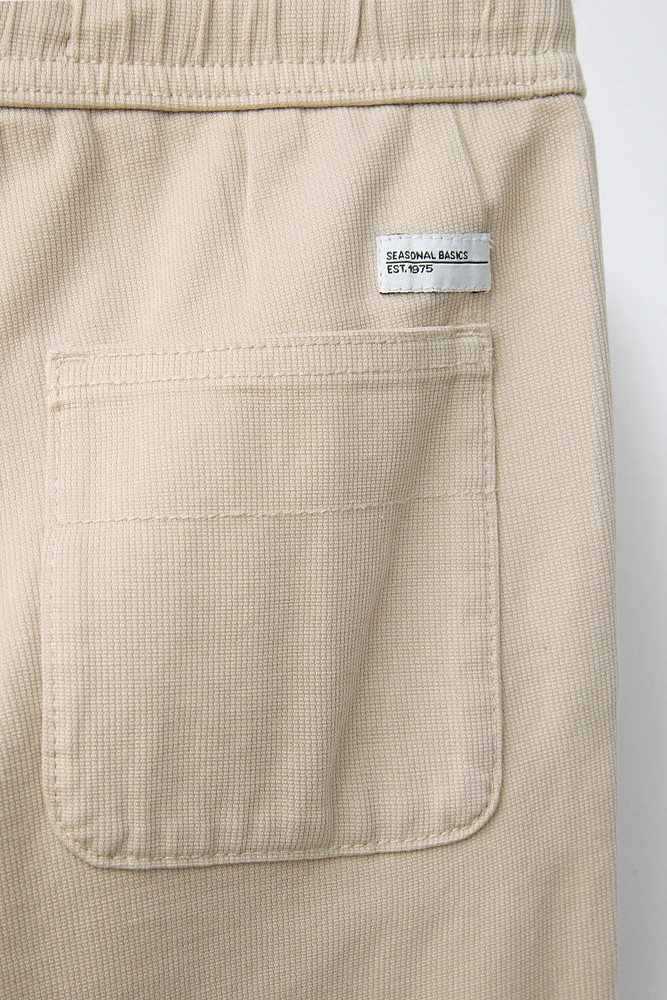 TEXTURED STRETCH PANTS
