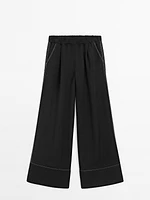 Flowing trousers with contrast topstitching