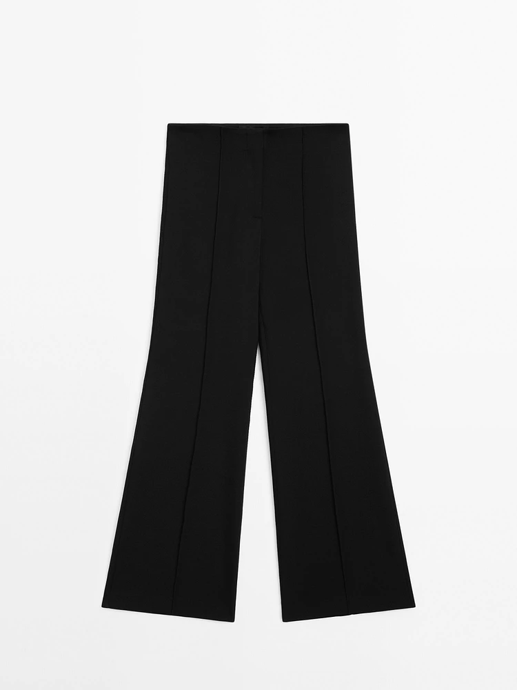 Flared trousers with zip