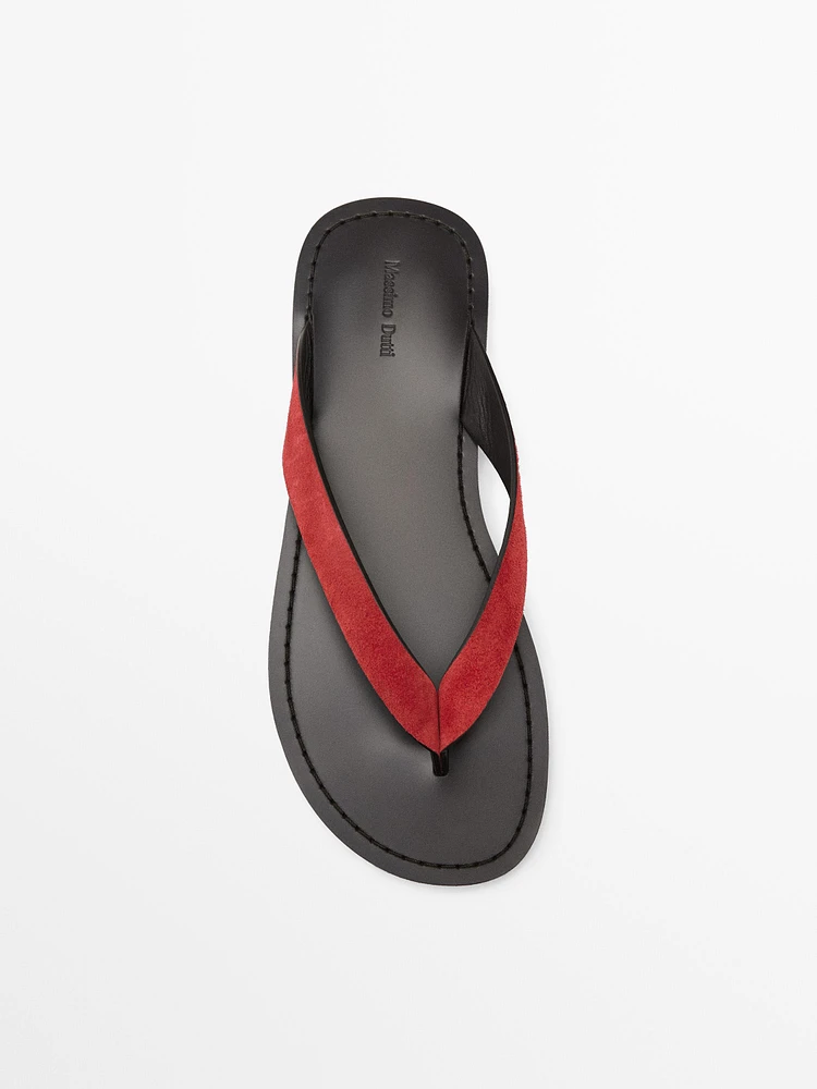 Split suede sandals with toe divider